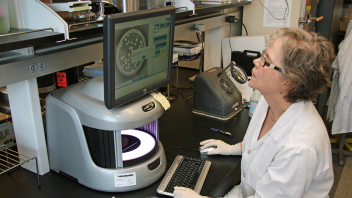 Linda Harris, Cooperative Extension specialist, working in a lab.