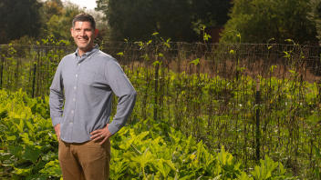 Ned Spang, associate professor of food science and technology, outside in a garden.