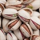 A pile of shelled pistachios.