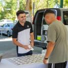 Dion Skaria, a food science major, sells his Fit Candy product at the Davis farmer's market. Photo by: Jael Mackendorf, UC Davis.